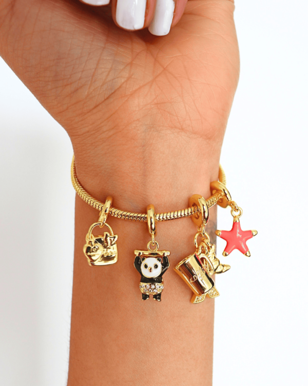 Pulsera con dijes en Covergold